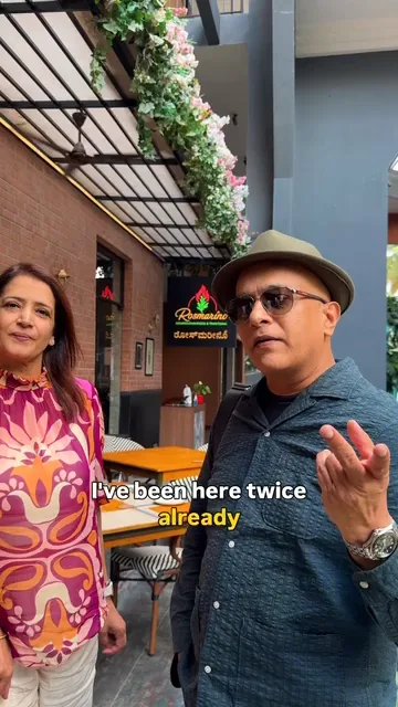 Food critic Kripal Amanna of Food Lovers TV outside Rosmarino, Indiranagar, saying on camera: “I've been here twice already”