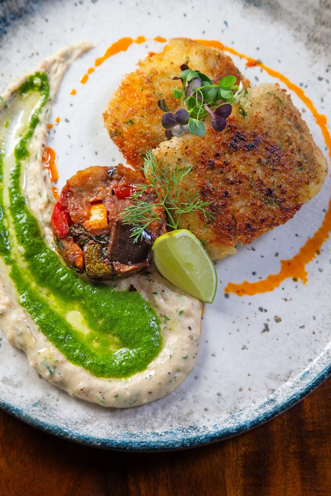 Muddica-crusted baked sea bream with white-bean purée and salsa verde at Rosmarino, Indiranagar