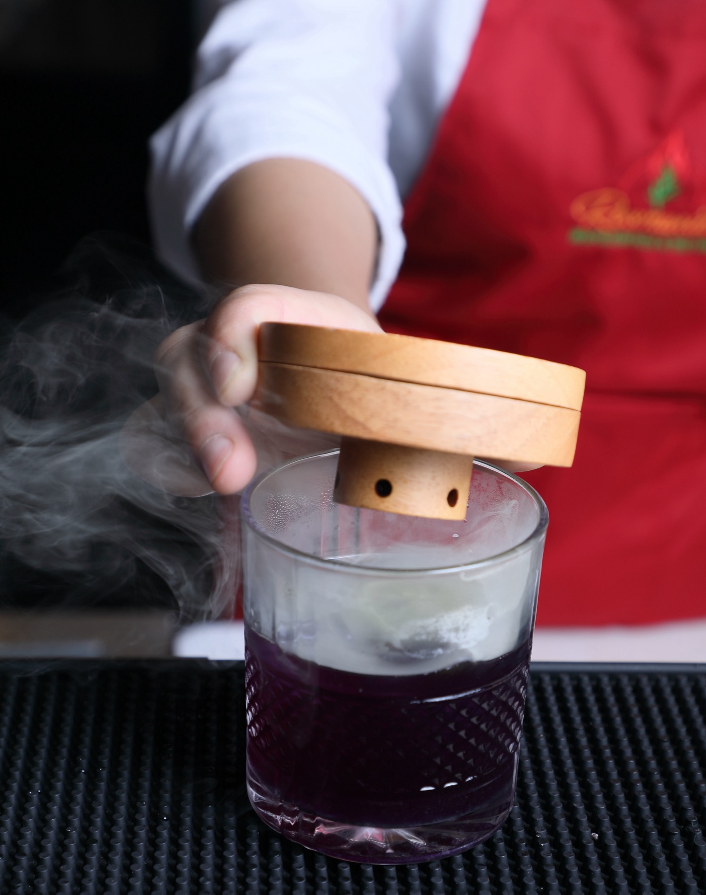 Smoked Blue Lavender — a purple signature cocktail finished under a wooden smoke cloche at Rosmarino, Indiranagar