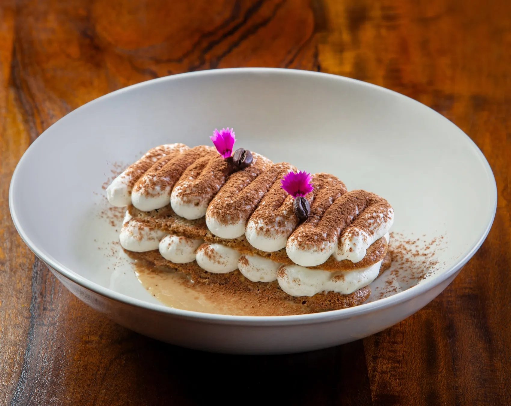 Signature tiramisu dusted with cocoa at Rosmarino, Indiranagar